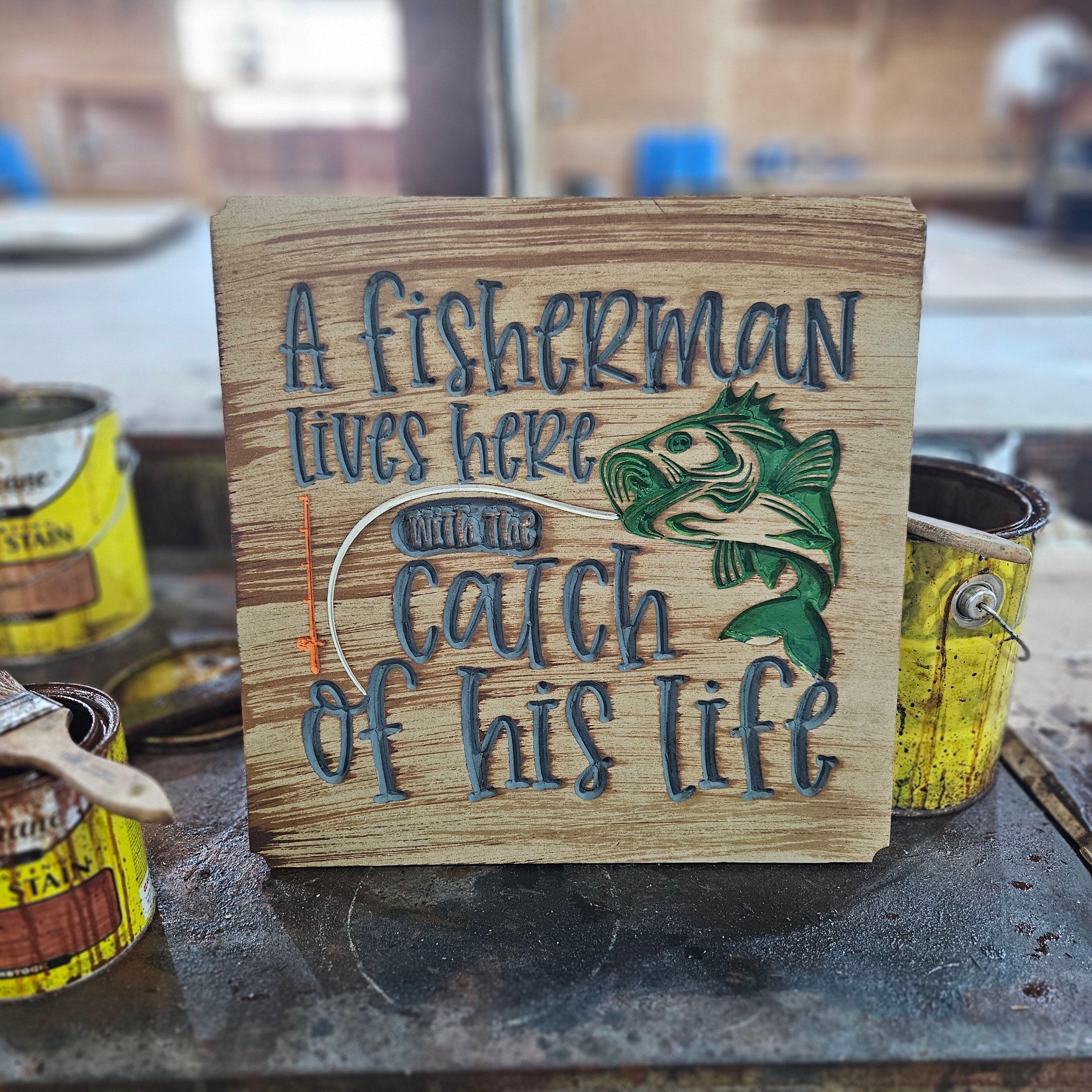 "A Fisherman Lives Here with the Catch of His Life" Wood Wall Art